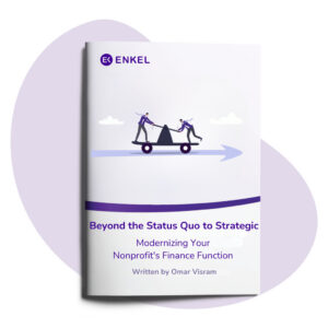 E-book cover titled “Beyond the Status Quo to Strategic: Modernizing Your Nonprofit’s Finance Function,” featuring an illustration of two people moving a boulder on a wheeled platform toward a forward arrow. Published by Enkel, the guide focuses on modern nonprofit financial strategy and strengthening finance operations.